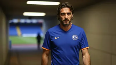 A 35mm f/2.8 lens captures a tight, waist-up shot of a 50-year-old, athletic, Xabi Alonso lookalike, Chelsea FC's new...